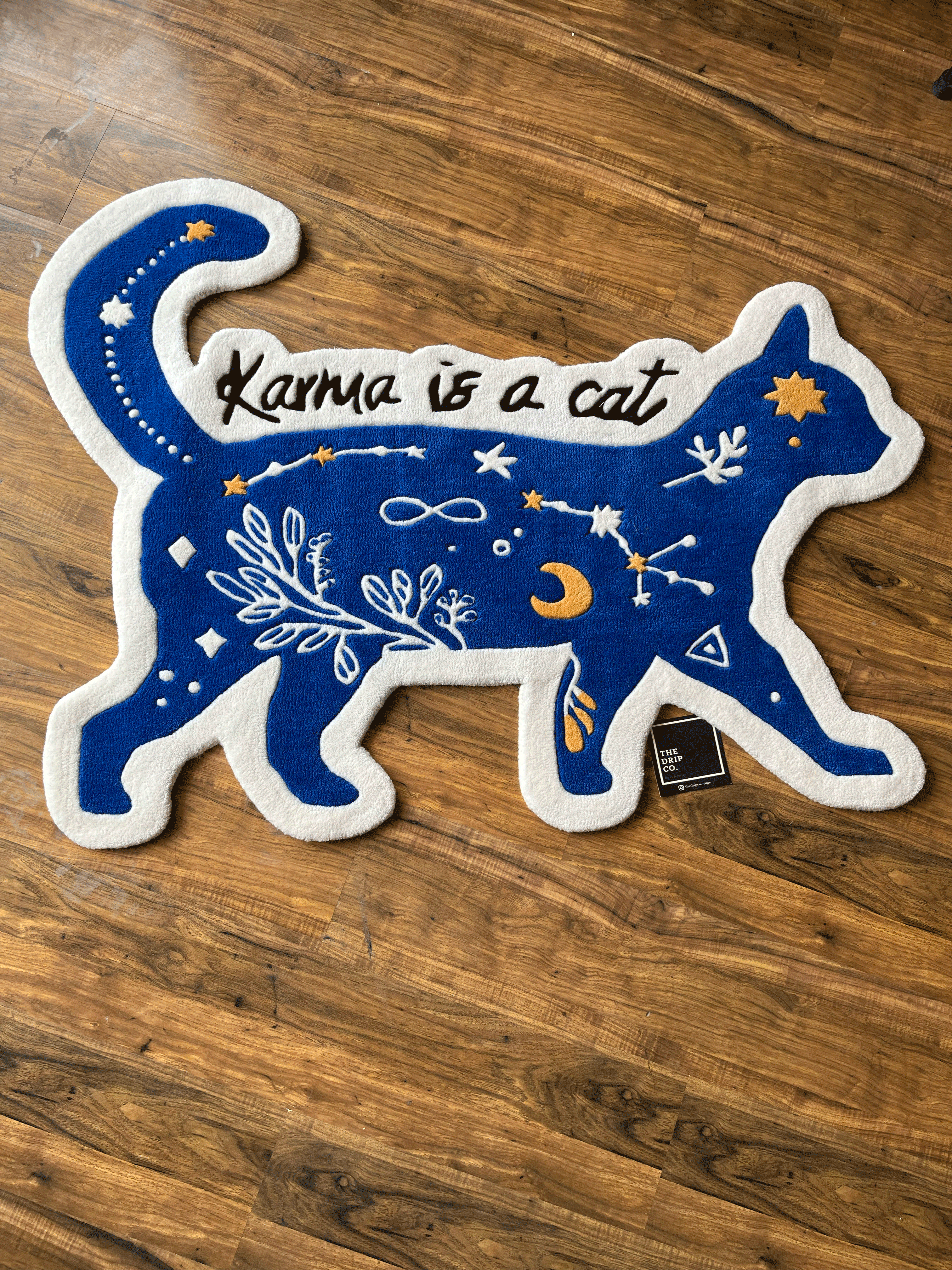 karma is a Cat hand tufted rug by The Drip Co.