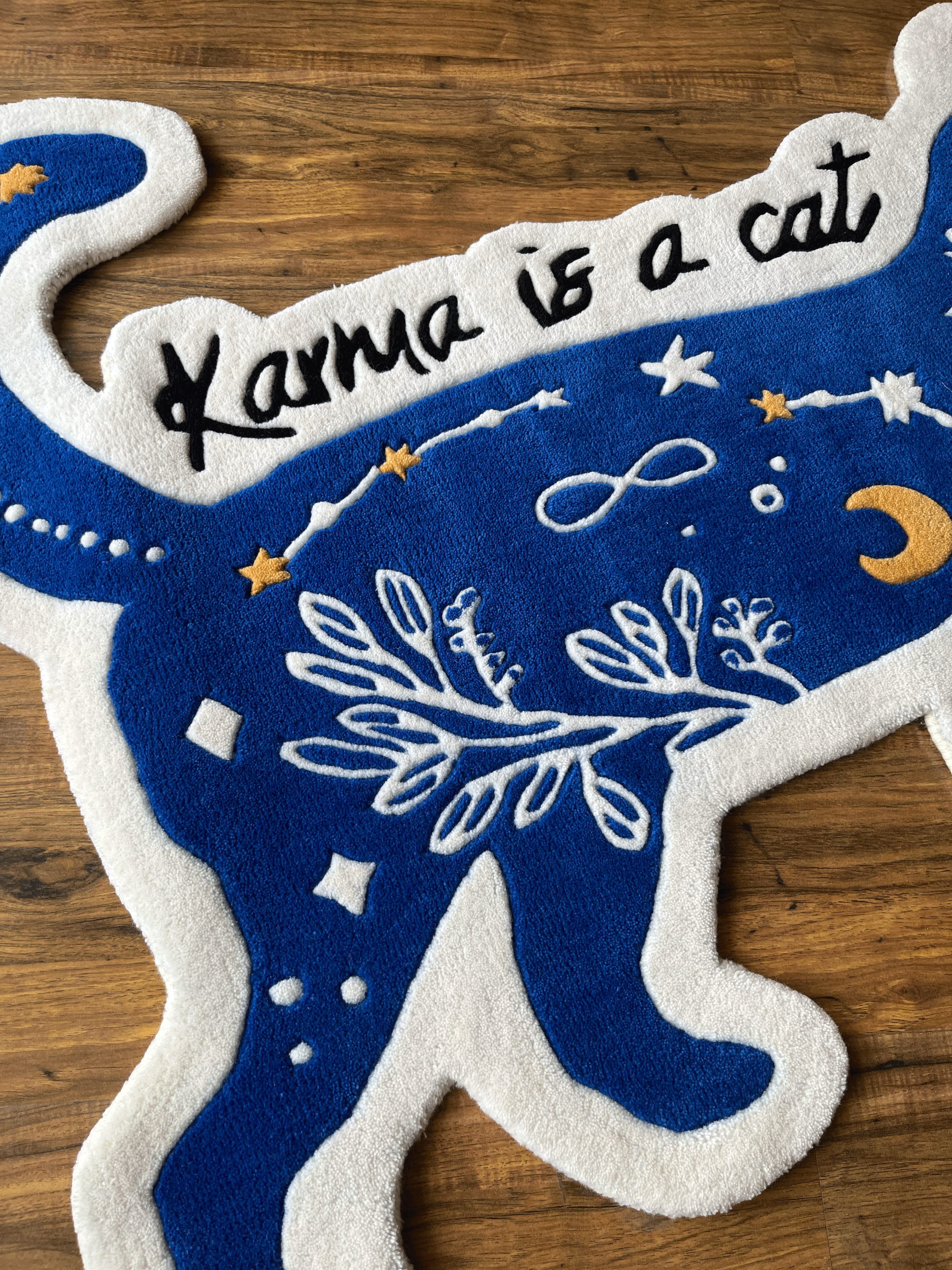 karma is a Cat hand tufted rug by The Drip Co.
