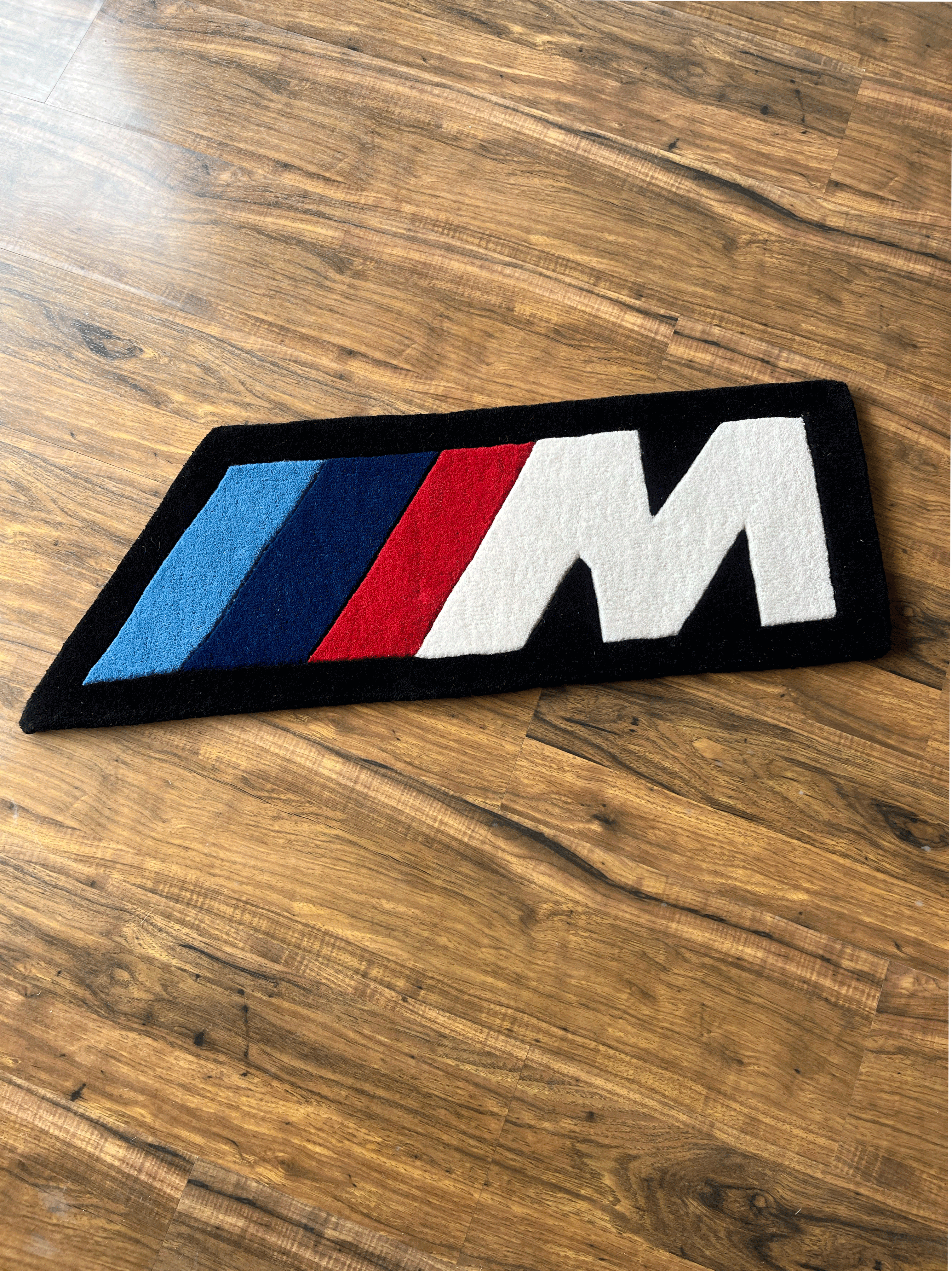 M speed racing Rug by The Drip Co.