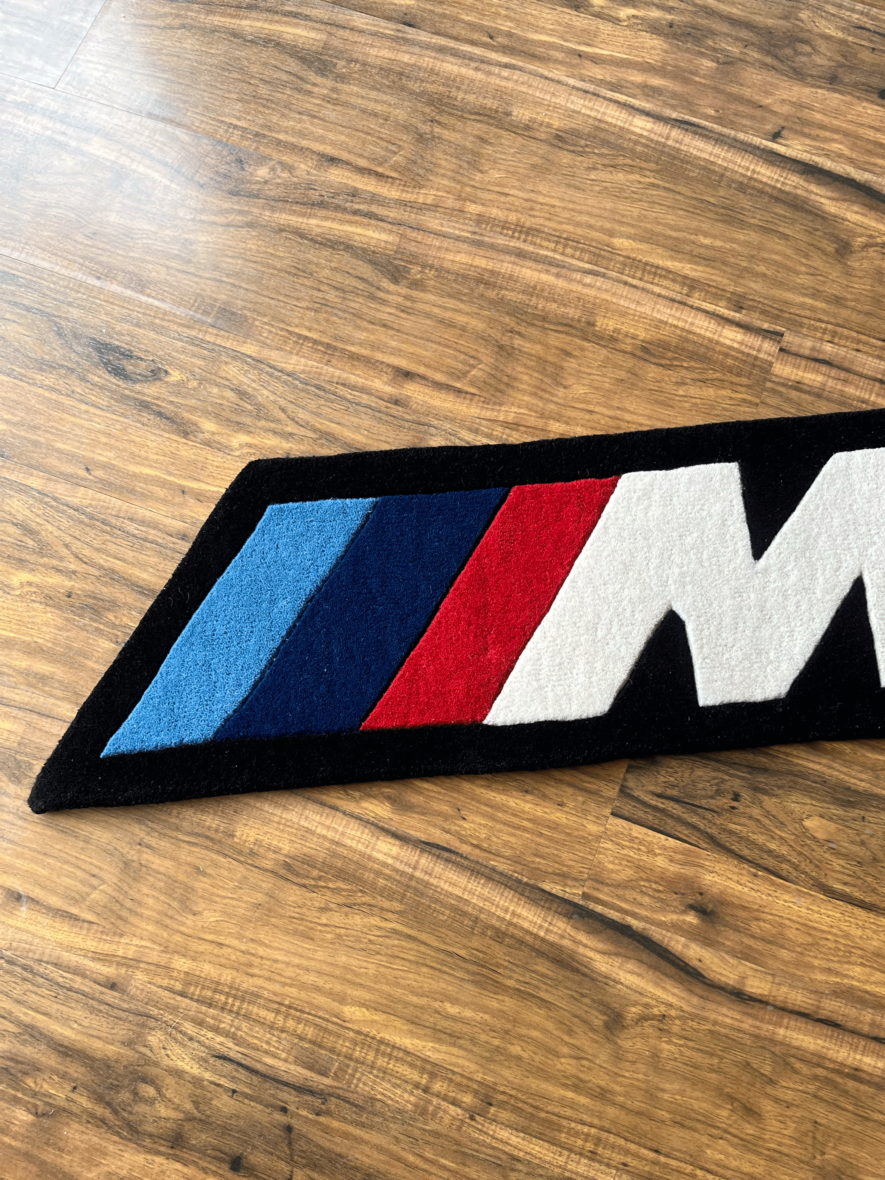 M speed racing Rug by The Drip Co.